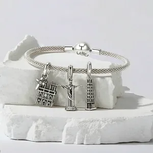 925 Sterling Silver woven bracelet featuring Notre Dame, Christ the Redeemer, and Leaning Tower charms