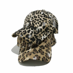 Vintage leopard print baseball cap with distressed torn details on washed canvas fabric