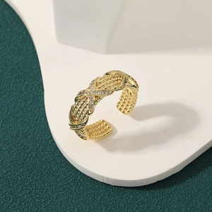 Elegant 18K gold plated copper ring with woven zircon design for a luxury look