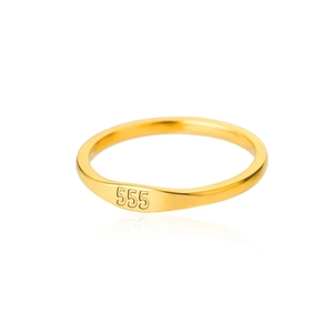 Macro view of gold stainless steel ring featuring 555 engraved angel numbers detail