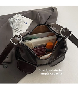 Top view of large capacity glossy leather shoulder bag showing spacious interior with essentials