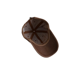 Brown vintage washed denim baseball cap with six-panel structure and embroidered brim detail