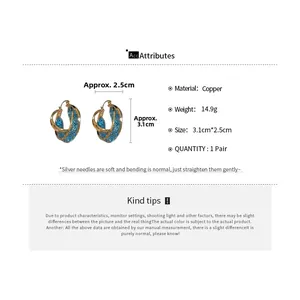 Detailed view of gold mesh earrings with copper material and silver pins for women