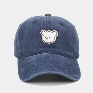 Navy blue baseball cap with cute white bear embroidery in a classic minimalist style