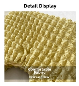 Detailed close-up of yellow bubble-textured fabric showing the soft pleated material
