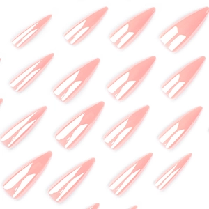 Glossy long stiletto artificial nails in soft pink color arranged on white background