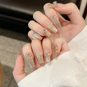 Luxury champagne cat-eye press-on nails with 3D butterfly and rhinestone accents