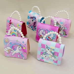 Detail view of assorted unicorn themed children purses with faux pearl handles and prints