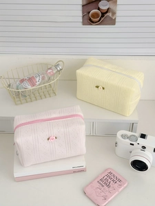 Floral knit makeup bags in pink and yellow waffle fabric with rose details