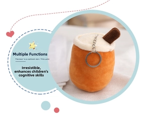 Detail of orange boba tea plush keychain with white cream top and metal clasp