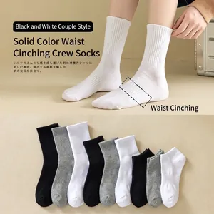 Multi-color cotton crew socks set in black, white and grey with ribbed arch support