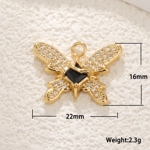 Macro view of gold bee pendant with white shell wings and measurements 22x16mm