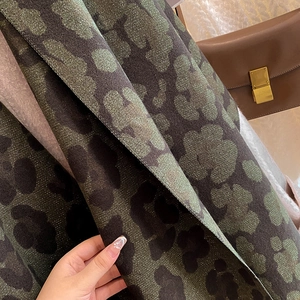 Close-up of leopard print cashmere feel scarf showing thick fabric and shimmering texture