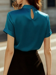 Detail of satin short sleeve shirt showing back keyhole closure and glossy silk texture