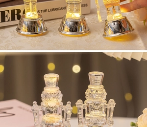 Macro detail of a clear crystal nutcracker soldier with warm LED lighting on base