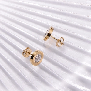 Golden stainless steel round stud earrings with Roman numerals and central crystals