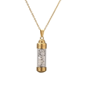 Detail view of gold perfume bottle pendant with Greek key pattern and white stones