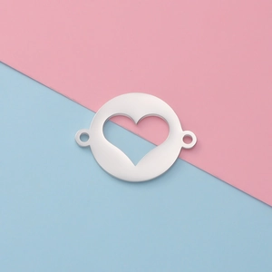 Close-up of silver hollow heart pendant connector for DIY jewelry with dual rings