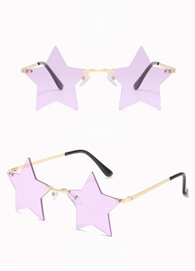 Detail view of star-shaped rimless sunglasses with gold metal frame and purple lenses