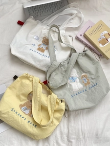 Cartoon embroidered canvas tote bags with drawstring closure in multiple colors