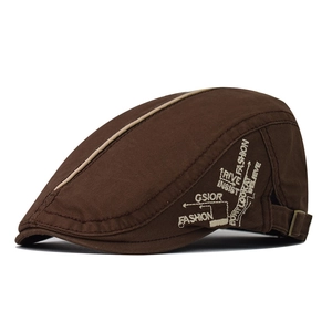 Detail view of coffee brown cotton flat cap with fashion embroidery and metal buckle
