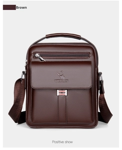 Detailed front view of brown textured leather shoulder bag with zipper and logo