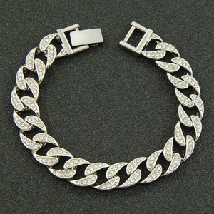 Hip hop style silver Cuban link bracelet with sparkling rhinestones on black background