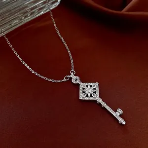 Luxury fashion rhodium plated key pendant necklace with zircon floral pattern detail
