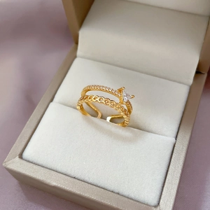 Gold double-layered open ring featuring a sparkling triangle zircon and textured bands