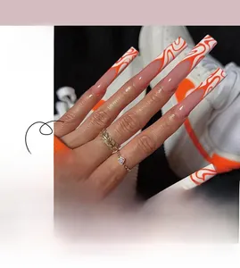 Detail of long coffin press-on nails featuring orange abstract flame patterns