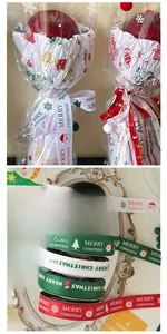 Close-up of high-density Christmas ribbon with Merry Christmas printing and icons