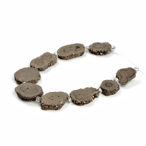 Tower-shaped crystal sunflower natural stone beads with metallic luster on white background
