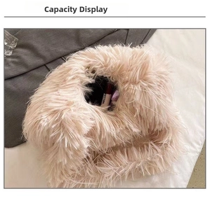 Detail view of the spacious inner capacity of the pink plush faux fur crossbody tote bag