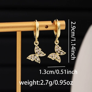 Detailed view of gold butterfly pendant earrings with white cubic zirconia and dimensions