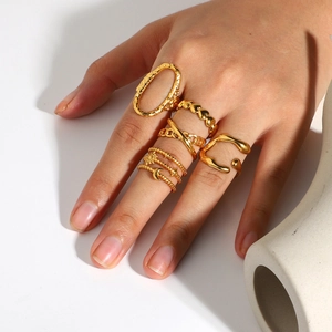 5-piece 18K gold plated minimalist rings set with heart and star patterns shown on hand