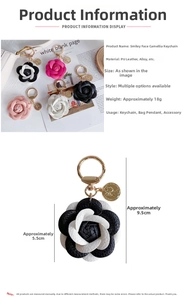 Close-up of stylish leather camellia flower keychain pendants in multiple colors