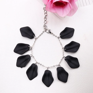 Bohemian style bracelet with matte black leaf pendants and silver metal chain link