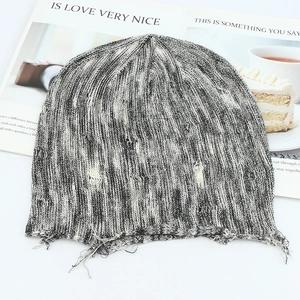 Distressed grey speckled knit beanie with frayed edge detail for a casual winter look