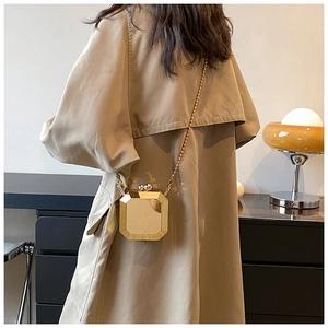 Chic gold octagonal acrylic clutch bag with metallic finish and thin chain strap