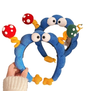 Cute plush cartoon headband with large eyes and polka dot mushrooms for hair styling