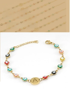 Detailed view of the 18K gold plated evil eye bracelet with colorful beads and letter A charm
