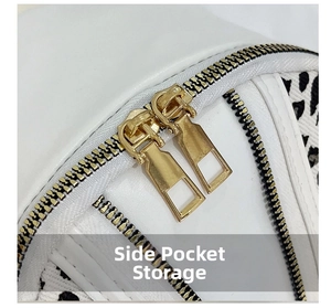 Macro detail of golden double zippers on white leather backpack with polka dot pattern