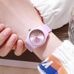 Close-up of lilac purple silicone quartz watch worn on wrist with a minimalist dial