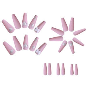 Pink press-on nails set with silver glitter hearts, stars and white bow accents