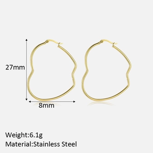 Detail view of 27mm gold heart-shaped stainless steel earrings with size measurements