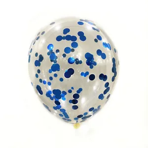 Detail of transparent latex balloon filled with decorative blue round sequins