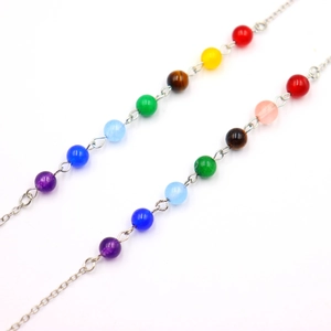 Silver chain necklace with seven chakra beads in vibrant colors for yoga and meditation