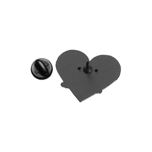 Detail view of the black heart-shaped metal pin back and rubber butterfly clutch fastener