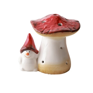 Red and white ceramic mushroom ornament with a cute gnome for Christmas decor