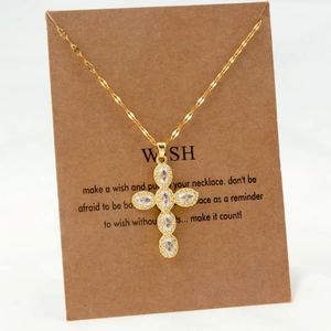 Golden stainless steel necklace featuring a vintage cross pendant with sparkling zircons
